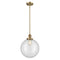 Beacon Mini Pendant shown in the Brushed Brass finish with a Clear shade