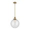 Beacon Mini Pendant shown in the Brushed Brass finish with a Seedy shade