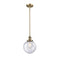 Beacon Mini Pendant shown in the Brushed Brass finish with a Seedy shade