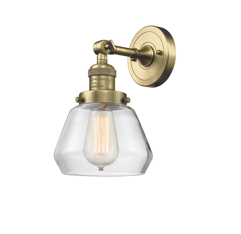 Innovations Lighting Fulton 1-100 watt 7 inch Antique Brass Sconce with Clear glass and Solid Brass 180 Degree Adjustable Swivel With Engraved Cast Cup 203ABG172