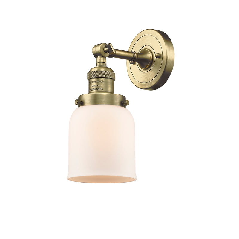 Bell Sconce shown in the Antique Brass finish with a Matte White shade