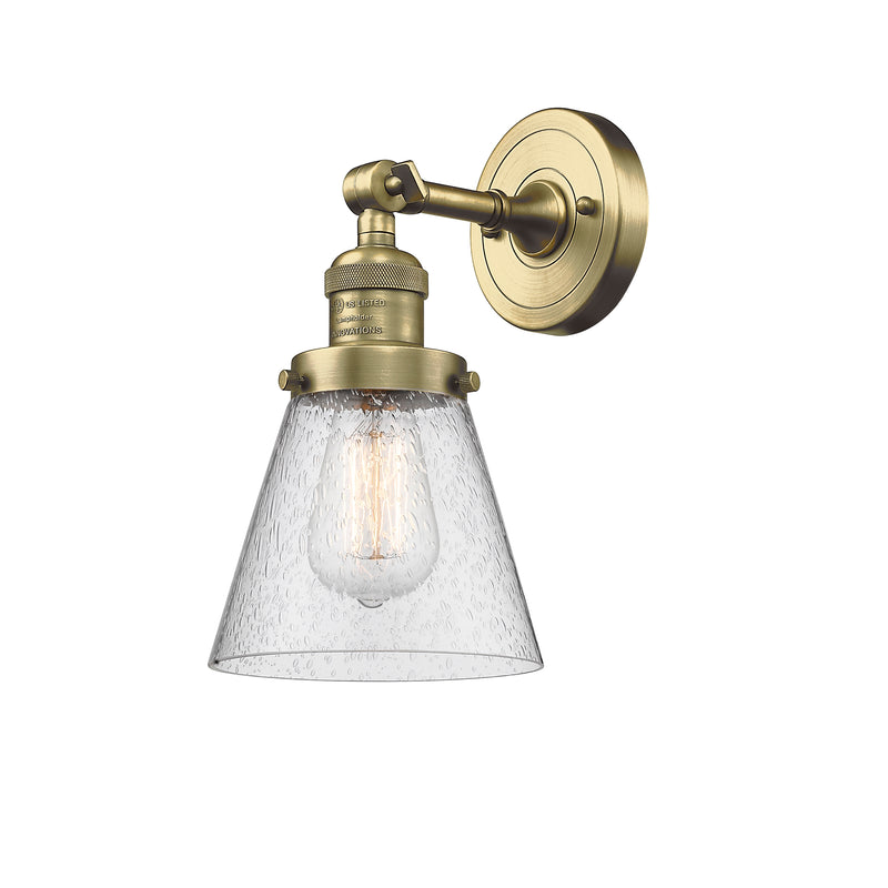 Cone Sconce shown in the Antique Brass finish with a Seedy shade