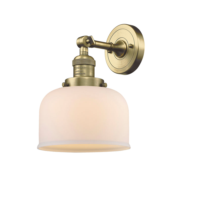 Bell Sconce shown in the Antique Brass finish with a Matte White shade