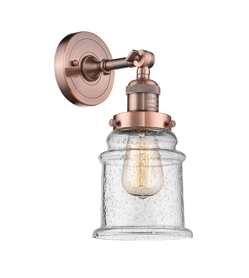 Innovations Lighting Canton 1-100 watt 6.5 inch Antique Copper Sconce with Seedy glass and Solid Brass 180 Degree Adjustable Swivel With Engraved Cast Cup 203ACG184