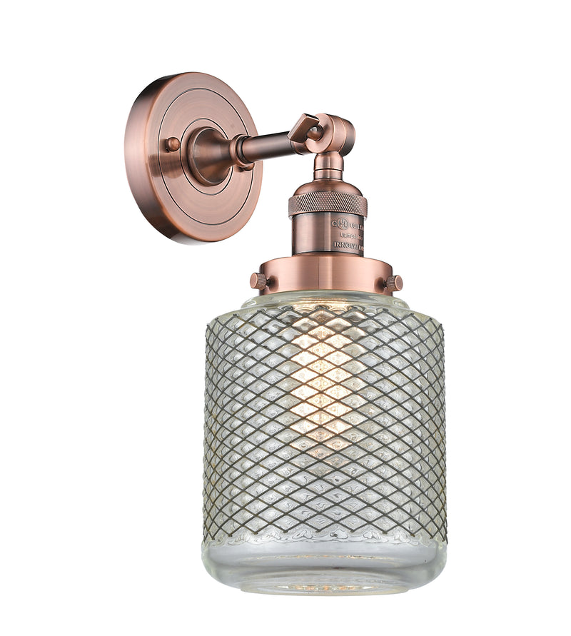 Innovations Lighting Stanton 1-100 watt 6 inch Antique Copper Sconce with Vintage Wire Mesh glass and Solid Brass 180 Degree Adjustable Swivel With Engraved Cast Cup 203ACG262