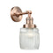 Colton Sconce shown in the Antique Copper finish with a Clear Halophane shade