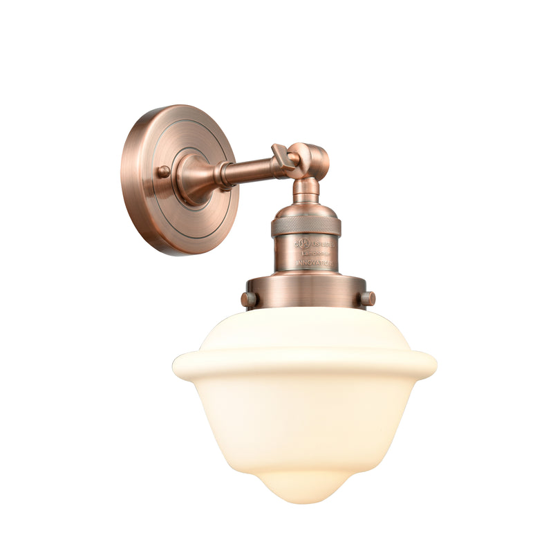 Oxford Sconce shown in the Antique Copper finish with a Matte White shade