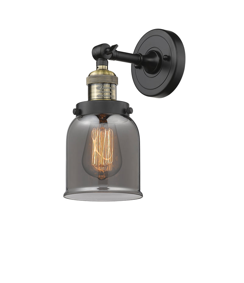 Innovations Lighting Small Bell 1-100 watt 5 inch Black Antique Brass Sconce with Smoked glass and Solid Brass 180 Degree Adjustable Swivel With Engraved Cast Cup 203BABG53