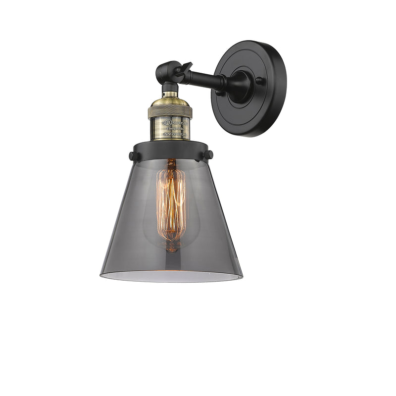 Cone Sconce shown in the Black Antique Brass finish with a Plated Smoke shade