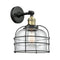 Bell Cage Sconce shown in the Black Antique Brass finish with a Clear shade