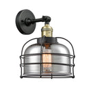 Bell Cage Sconce shown in the Black Antique Brass finish with a Plated Smoke shade