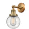 Beacon Sconce shown in the Brushed Brass finish with a Seedy shade