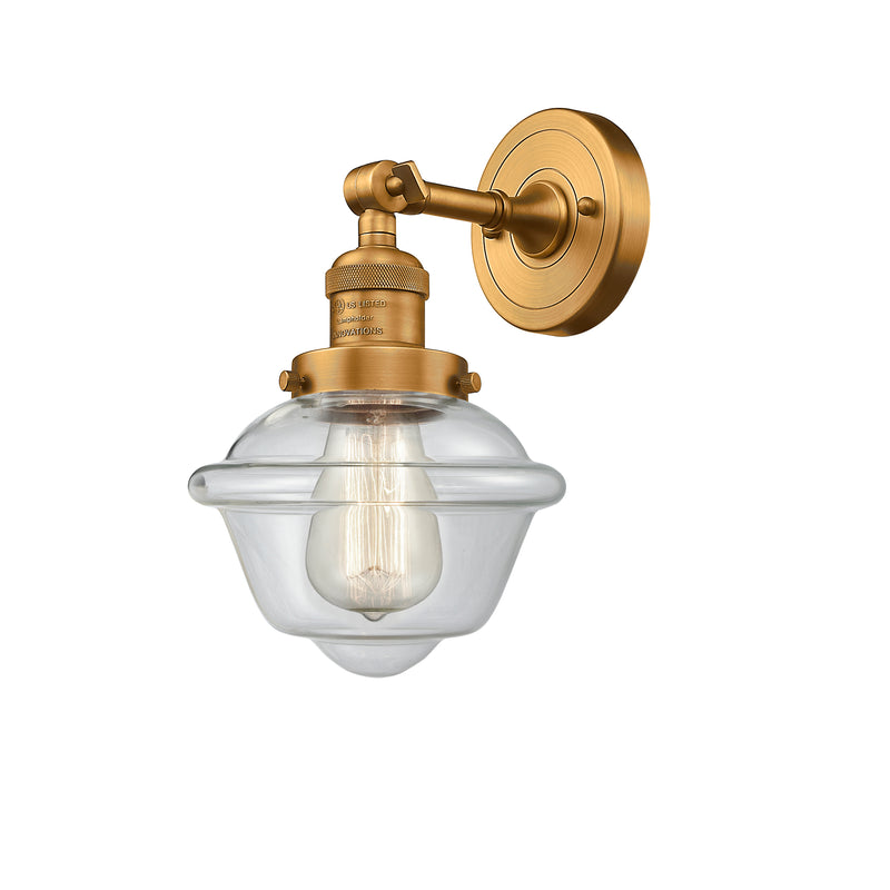 Oxford Sconce shown in the Brushed Brass finish with a Clear shade