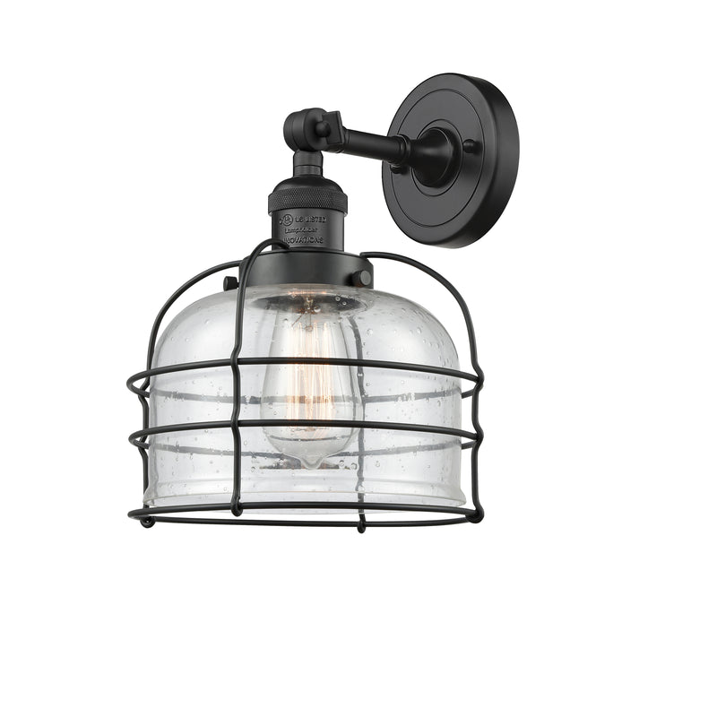 Bell Cage Sconce shown in the Matte Black finish with a Seedy shade