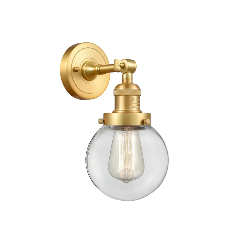 Beacon Sconce shown in the Satin Gold finish with a Clear shade