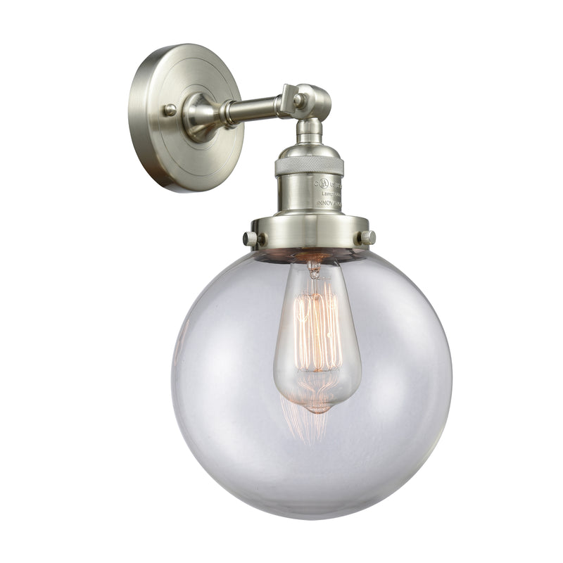 Beacon Sconce shown in the Brushed Satin Nickel finish with a Clear shade