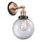 Beacon Sconce shown in the Antique Copper finish with a Clear shade