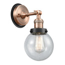 Beacon Sconce shown in the Antique Copper finish with a Seedy shade