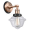 Oxford Sconce shown in the Antique Copper finish with a Clear shade