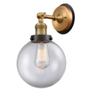 Beacon Sconce shown in the Brushed Brass finish with a Clear shade