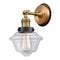 Oxford Sconce shown in the Brushed Brass finish with a Clear shade