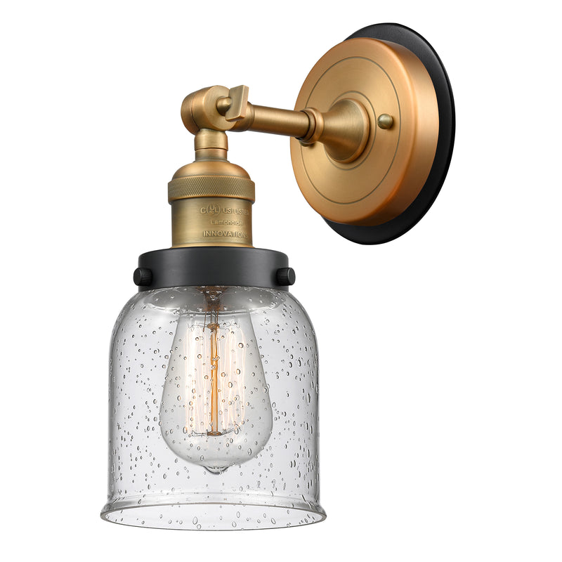 Bell Sconce shown in the Brushed Brass finish with a Seedy shade