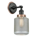 Stanton Sconce shown in the Matte Black finish with a Clear Wire Mesh shade