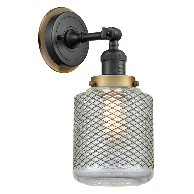 Stanton Sconce shown in the Matte Black finish with a Clear Wire Mesh shade