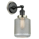 Stanton Sconce shown in the Matte Black finish with a Clear Wire Mesh shade