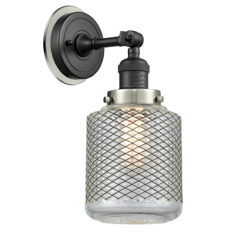 Stanton Sconce shown in the Matte Black finish with a Clear Wire Mesh shade