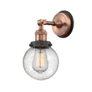 Beacon Sconce shown in the Antique Copper finish with a Seedy shade