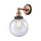 Beacon Sconce shown in the Antique Copper finish with a Seedy shade