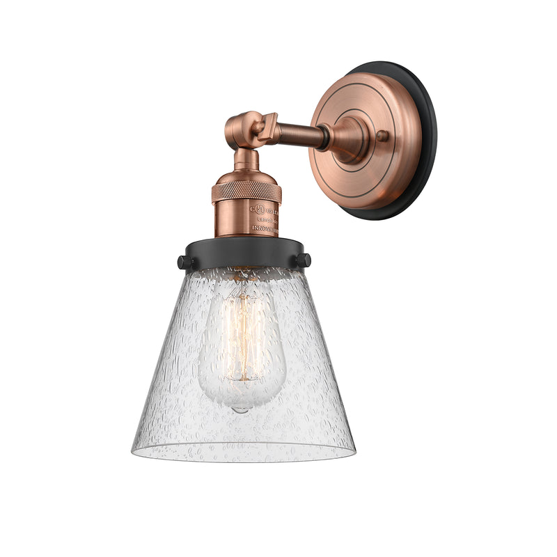 Cone Sconce shown in the Antique Copper finish with a Seedy shade