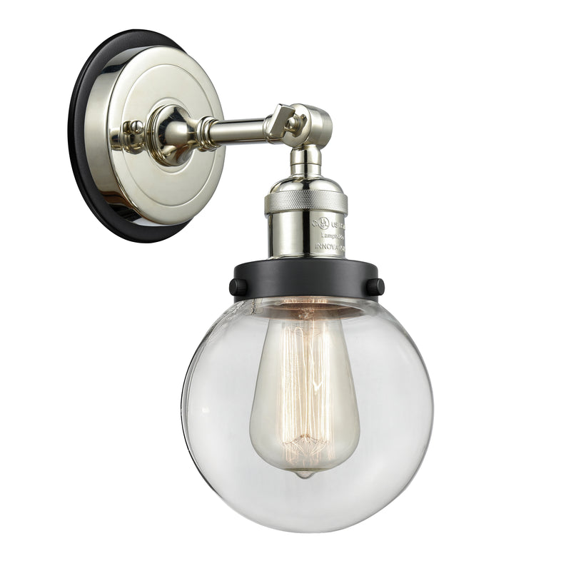 Beacon Sconce shown in the Polished Nickel finish with a Clear shade