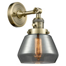 Fulton Sconce shown in the Antique Brass finish with a Plated Smoke shade