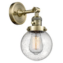 Beacon Sconce shown in the Antique Brass finish with a Seedy shade