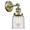 Bell Sconce shown in the Antique Brass finish with a Clear shade