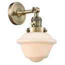 Oxford Sconce shown in the Antique Brass finish with a Matte White shade