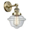 Oxford Sconce shown in the Antique Brass finish with a Clear shade