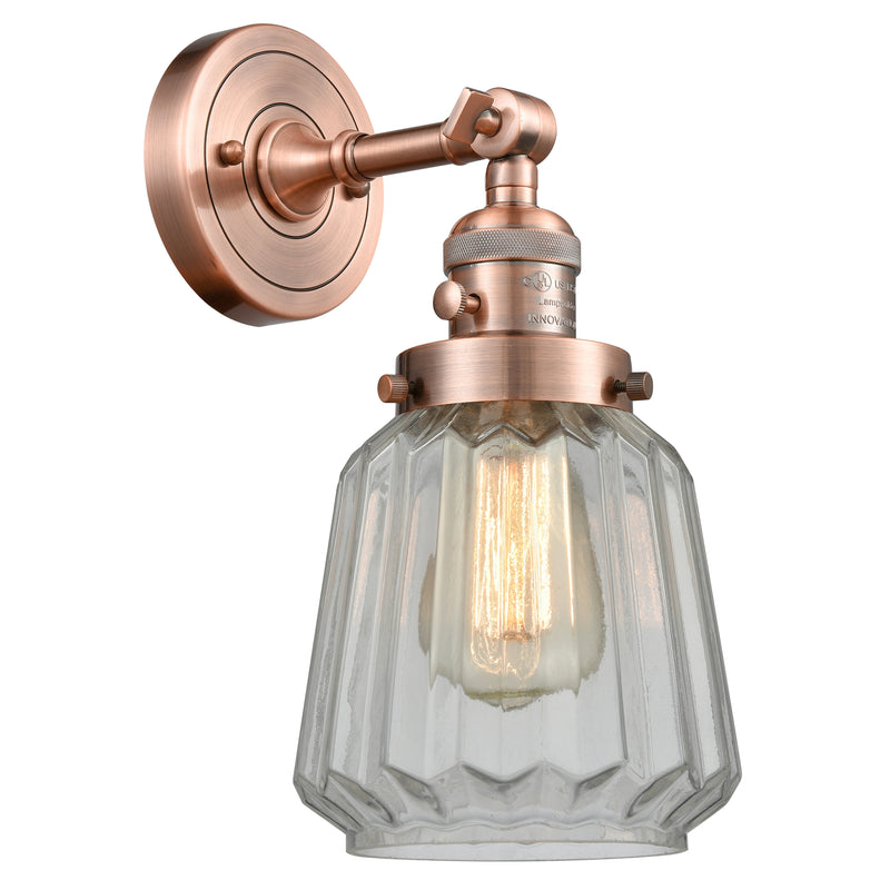 Chatham Sconce shown in the Antique Copper finish with a Clear shade