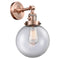 Beacon Sconce shown in the Antique Copper finish with a Clear shade