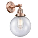 Beacon Sconce shown in the Antique Copper finish with a Seedy shade