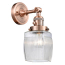 Colton Sconce shown in the Antique Copper finish with a Clear Halophane shade