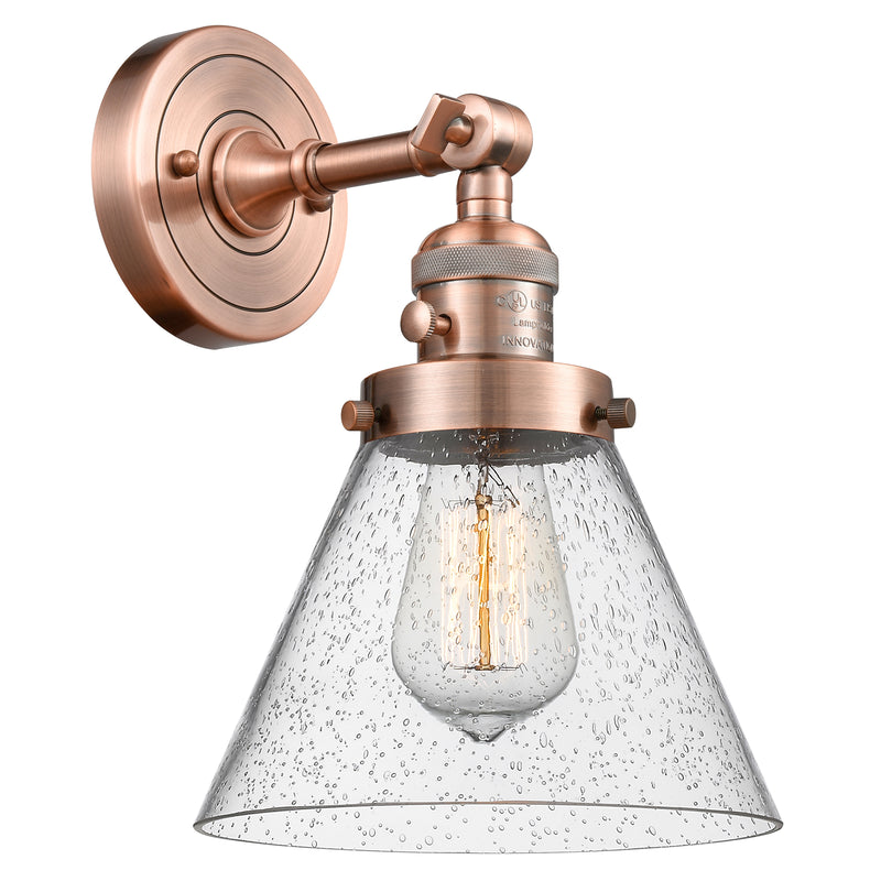 Cone Sconce shown in the Antique Copper finish with a Seedy shade