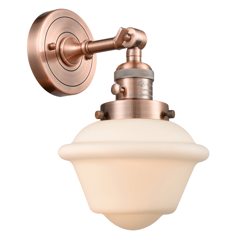 Oxford Sconce shown in the Antique Copper finish with a Matte White shade