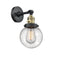 Innovations Lighting Beacon 1-100 watt 6 inch Black Antique Brass Sconce with Seedy glass and Solid Brass 180 Degree Adjustable Swivel With Engraved Cast Cup Includes a "High-Low-Off" Switch. 203SWBABG2046