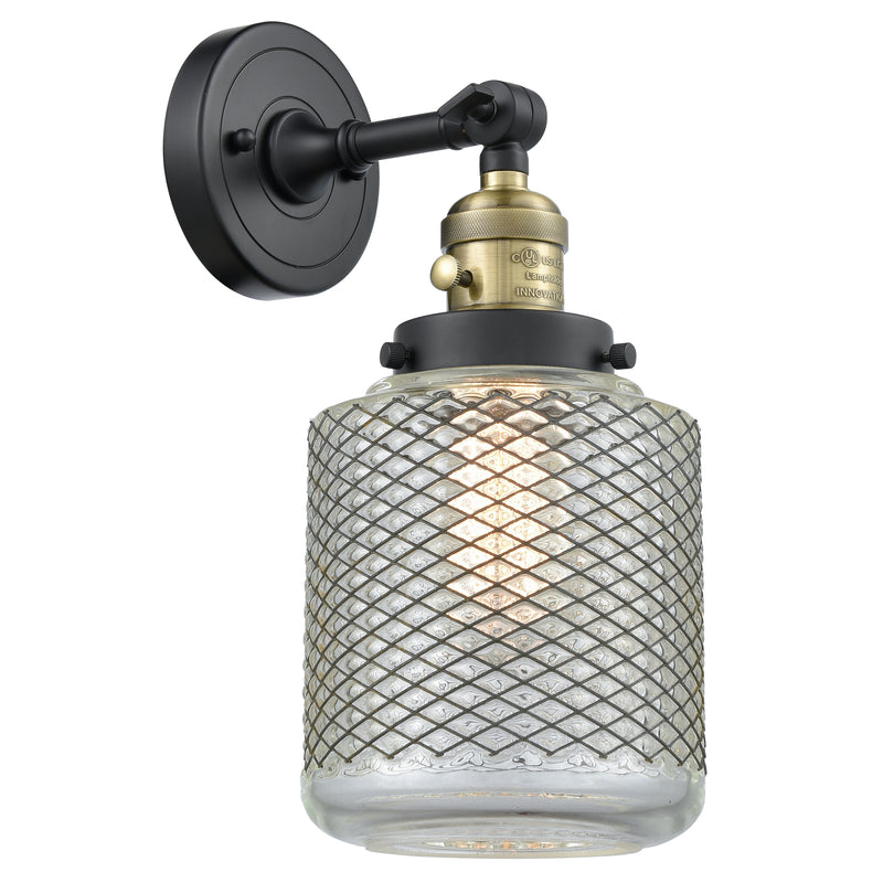 Stanton Sconce shown in the Black Antique Brass finish with a Clear Wire Mesh shade