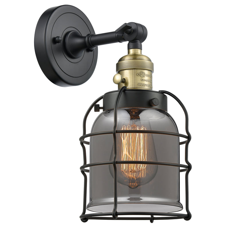 Bell Cage Sconce shown in the Black Antique Brass finish with a Plated Smoke shade