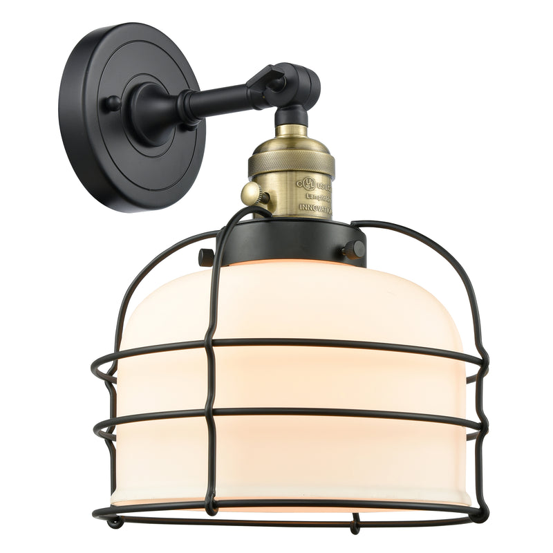 Bell Cage Sconce shown in the Black Antique Brass finish with a Matte White shade
