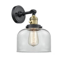 Innovations Lighting Large Bell 1-100 watt 8 inch Black Antique Brass Sconce with Clear glass and Solid Brass 180 Degree Adjustable Swivel With Engraved Cast Cup Includes a "High-Low-Off" Switch. 203SWBABG72